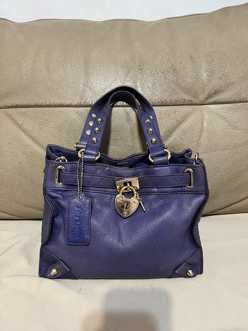 Juicy Couture Leather Satchel (Category: Luxury Bags & Wallets) located in Calamba. Submitted by jupreloved_ (Listing ID 1470793397, Image 1). Description: Juicy Couture deep purple leather satchel bag with gold-tone hardware, heart-shaped lock, studded handles, and leopard print interior lining. Includes dual top handles and an adjustable shoulder strap. Brand: Juicy Couture Size: Small Shipping through J&T. Payment are strictly through GCASH on