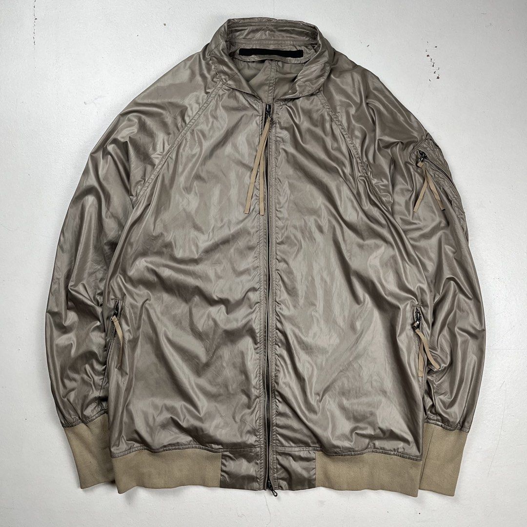 Julius x IT Taffeta MA-1 Bomber Jacket (Category: Coats, Jackets and Outerwear) located in Quezon City. Submitted by forgarments (Listing ID 1470850800, Image 1). Description: Julius x IT Taffeta MA-1 Bomber Jacket Excellent Condition - Minor Abrasion & Stains (see the photo for more details) Size: 3 Chest width: 23 Inches Length: 30 Inches Hem: 21.5 Inches - Taffeta weave - MA-Bomber silhouette - Left sleeve Utility Pocket - 2 hand zippered pock