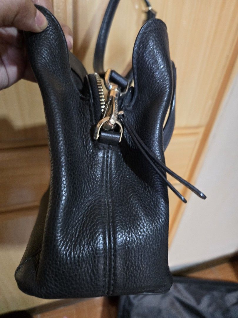 Kate Spade Black Leather Tote Shoulder Bag (Category: Tote Bags) located in Quezon City. Submitted by mycloset_2016 (Listing ID 1470767916, Image 3). Description: - Brand: Kate Spade - Material: Premium black pebbled leather - Hardware: Elegant gold-tone accents with secure zipper closure - Versatile Carry: Includes top carry handles and an adjustable long shoulder strap - Practical Design: Features side gussets and protective metal feet on the b