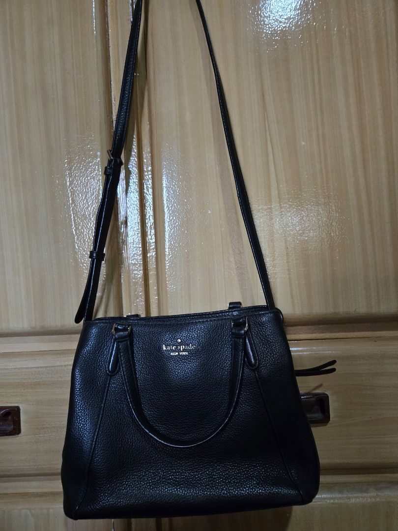 Kate Spade Black Leather Tote Shoulder Bag (Category: Tote Bags) located in Quezon City. Submitted by mycloset_2016 (Listing ID 1470767916, Image 2). Description: - Brand: Kate Spade - Material: Premium black pebbled leather - Hardware: Elegant gold-tone accents with secure zipper closure - Versatile Carry: Includes top carry handles and an adjustable long shoulder strap - Practical Design: Features side gussets and protective metal feet on the b