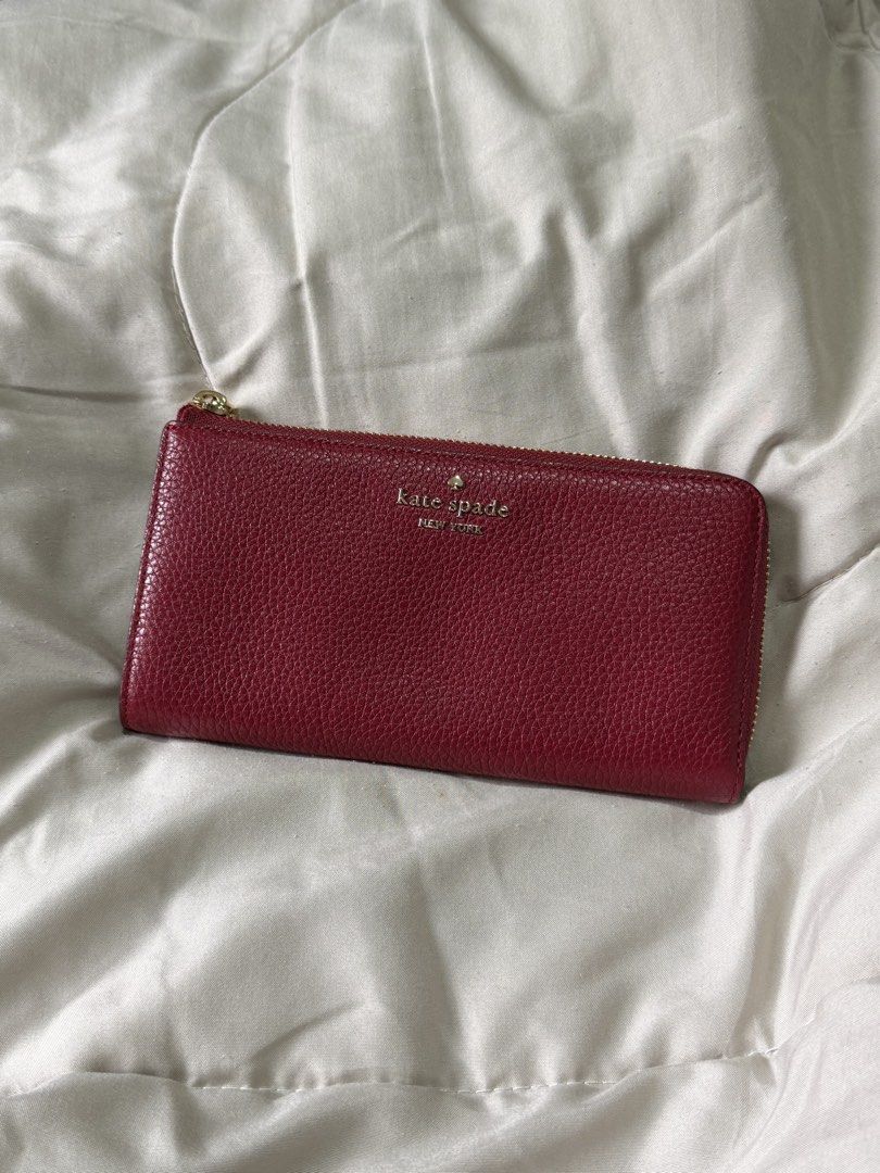 Kate Spade Large Slim L-Zip Wallet (Category: Wallets & Card holders) located in Marikina City. Submitted by welllovedbycarina (Listing ID 1470783683, Image 1). Description: 🍎Guaranteed original Kate Spade 🍎 No inclusions 🍎 This is in excellent condition po, no issues at all. Can pass as brand new! 🍎 Color is Red Jam, ang stunning in person! 🍎 Used for about 3 days lang. 🍎 RFS: Too big for me Style Number: KP354 Measurements Length: 7.84” H
