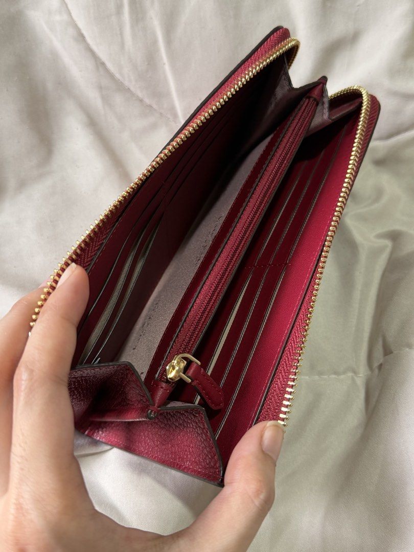 Kate Spade Large Slim L-Zip Wallet (Category: Wallets & Card holders) located in Marikina City. Submitted by welllovedbycarina (Listing ID 1470783683, Image 3). Description: 🍎Guaranteed original Kate Spade 🍎 No inclusions 🍎 This is in excellent condition po, no issues at all. Can pass as brand new! 🍎 Color is Red Jam, ang stunning in person! 🍎 Used for about 3 days lang. 🍎 RFS: Too big for me Style Number: KP354 Measurements Length: 7.84” H