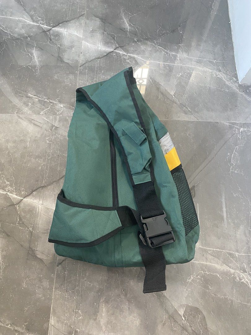 Kawasaki Sling Bag - Vintage (Category: Sling Bags) located in Pasig City. Submitted by silentgem-ac4d (Listing ID 1470765947, Image 2). Description: - Authentic green Kawasaki sling bag with striking yellow and silver accents - Secure quick-release buckle closure and zippered main compartment - Comfortable, adjustable black shoulder strap for daily commuting - Convenient mesh side pocket for water bottles or essentials - Ideal for motorcycle ent