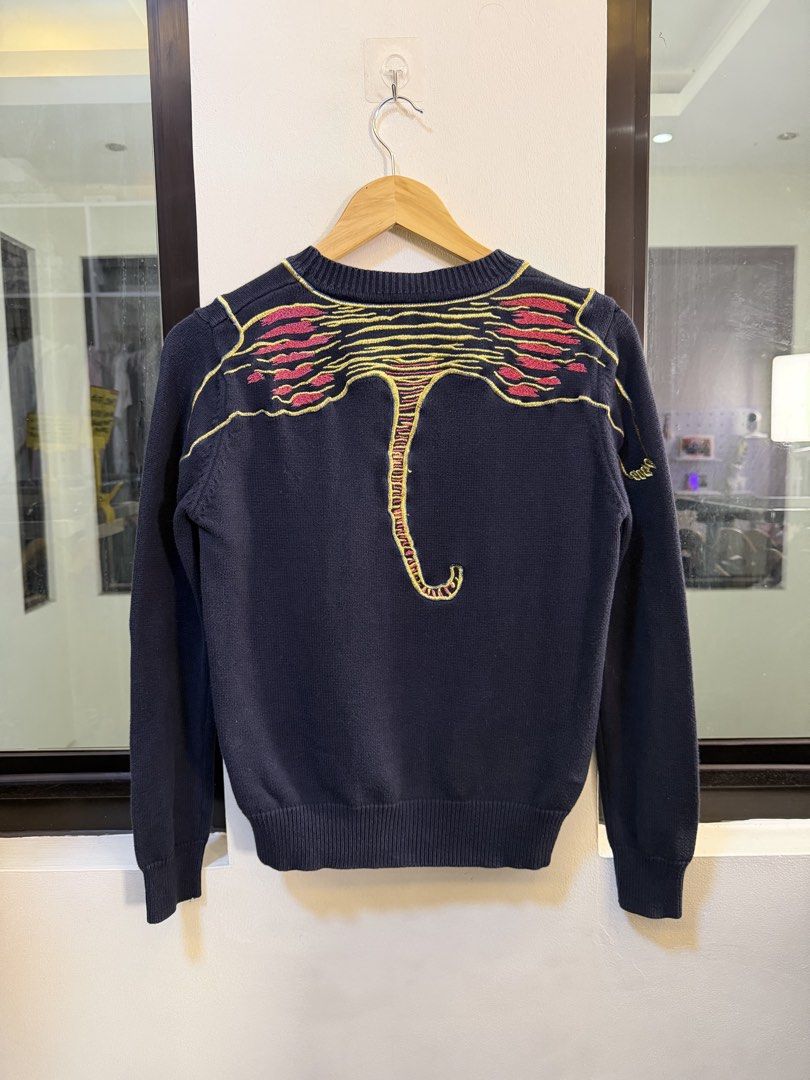 Kenzo Paris Crewneck Knit Sweater (Category: Coats, Jackets and Outerwear) located in Paranaque City. Submitted by preluxeshop_ph (Listing ID 1470809117, Image 3). Description: Brand: Kenzo Paris -Style: Crewneck Knit Sweater / Pullover -Color: Dark Navy Blue -Design Features: Vibrant multi-color embroidered Tiger head graphic across the chest, detailed tiger back print/embroidery pattern, and ribbed crewneck, cuffs, and hem -Material Composition