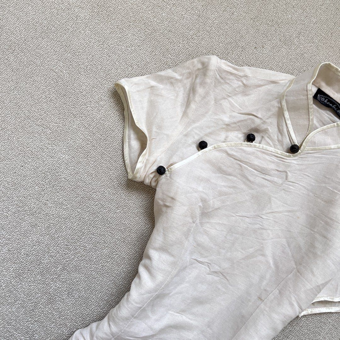 khenki oat qi pao top (Category: Blouses) located in Limay. Submitted by budolfindsrawrawr (Listing ID 1470784295, Image 3). Description: khenki oat qi pao top - fits medium l25 b34-36 - fabric feels like linen (no washtags) - in excellent condition .