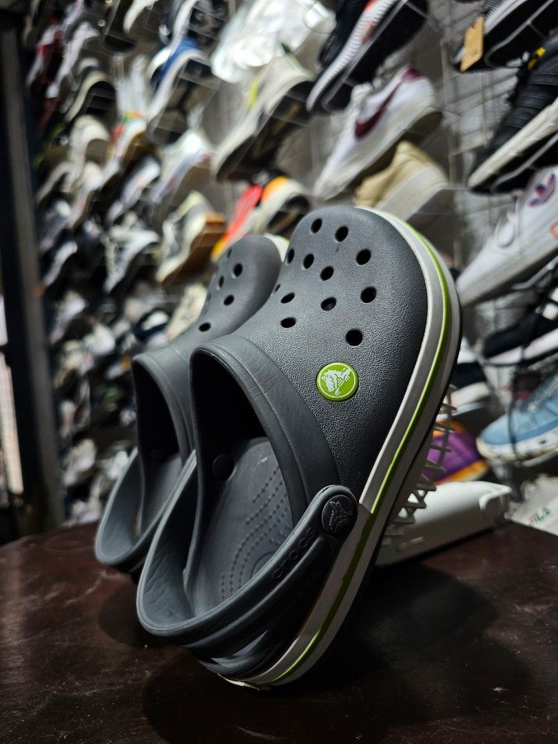Kids Grey Crocs Crocband Clogs (FREE SHIPPING) (Category: Babies & Kids Fashion) located in Baguio. Submitted by kayeonlineshop (Listing ID 1470787907, Image 3). Description: (FREE SHIPPING!!!) Description: Selling an authentic, pre-owned pair of kids Crocs Crocband Clogs in Charcoal Grey. Features a sporty white and lime green stripe design along the sides. Super comfortable, lightweight, and perfect for active kids. Easy to wash down after play