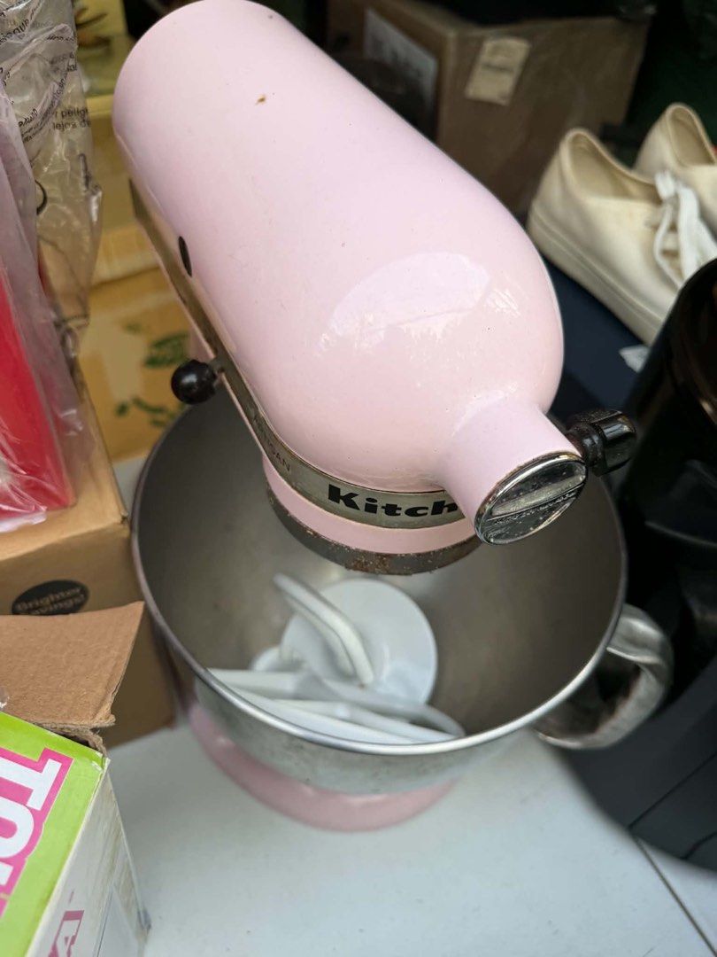 KitchenAid Artisan Stand Mixer Pink (Category: Hand & Stand Mixers) located in Quezon City. Submitted by tradingcardsandmore (Listing ID 1470801315, Image 2). Description: - Authentic KitchenAid Artisan stand mixer in a charming pink color - Includes a stainless steel mixing bowl and white paddle attachment - Classic tilt-head design, perfect for baking, whipping, and kneading dough - Heavy-duty countertop appliance that works great for daily kit