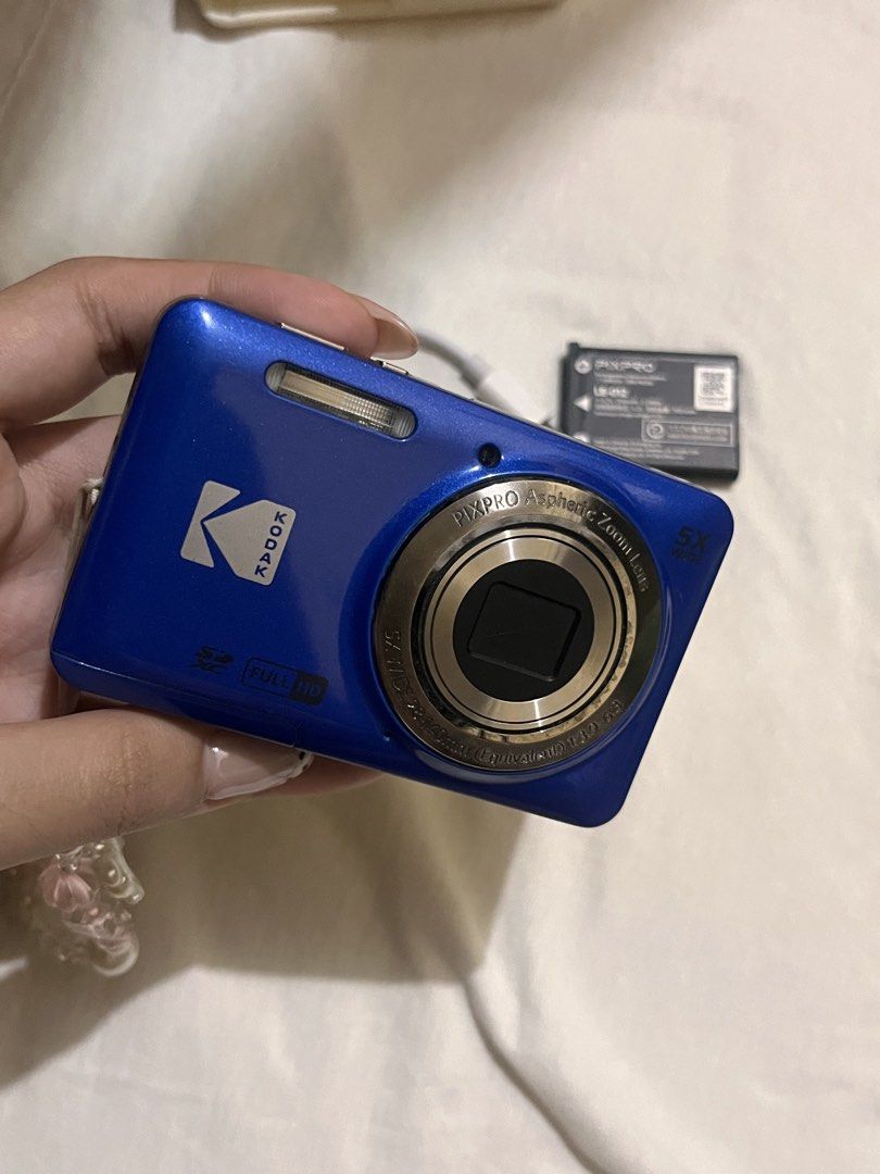Kodak PixPro digital camera blue bundle with battery and case (Category: Cameras) located in Legazpi City. Submitted by sandras. (Listing ID 1470874945, Image 3). Description: - Model: Blue Kodak PixPro compact digital camera - Condition: Fully functional and ready to shoot - Inclusions: Rechargeable PIXPRO LB-012 battery, white silicone protective case, charging cable block, and beaded wrist strap - Storage: Uses standard SD cards - Best for: Ev