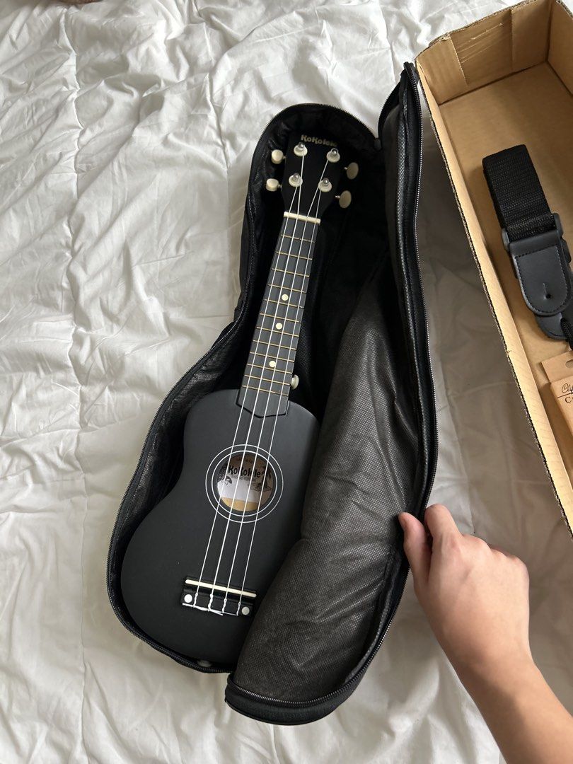 SET Matte Black Soprano Ukulele Complete with Bag, Strap, and Capo (Category: Musical Instruments) located in Manila. Submitted by jmcl.declutters (Listing ID 1470874001, Image 2). Description: KoKolele Soprano ukulele (great starter bundle) - COMPLETE set comes with a black gig bag (with shoulder strap and extra front zip compartment), adjustable uke strap (brand new), and clip-on capo (brand new) - Condition: Clean finish with intact sound hole