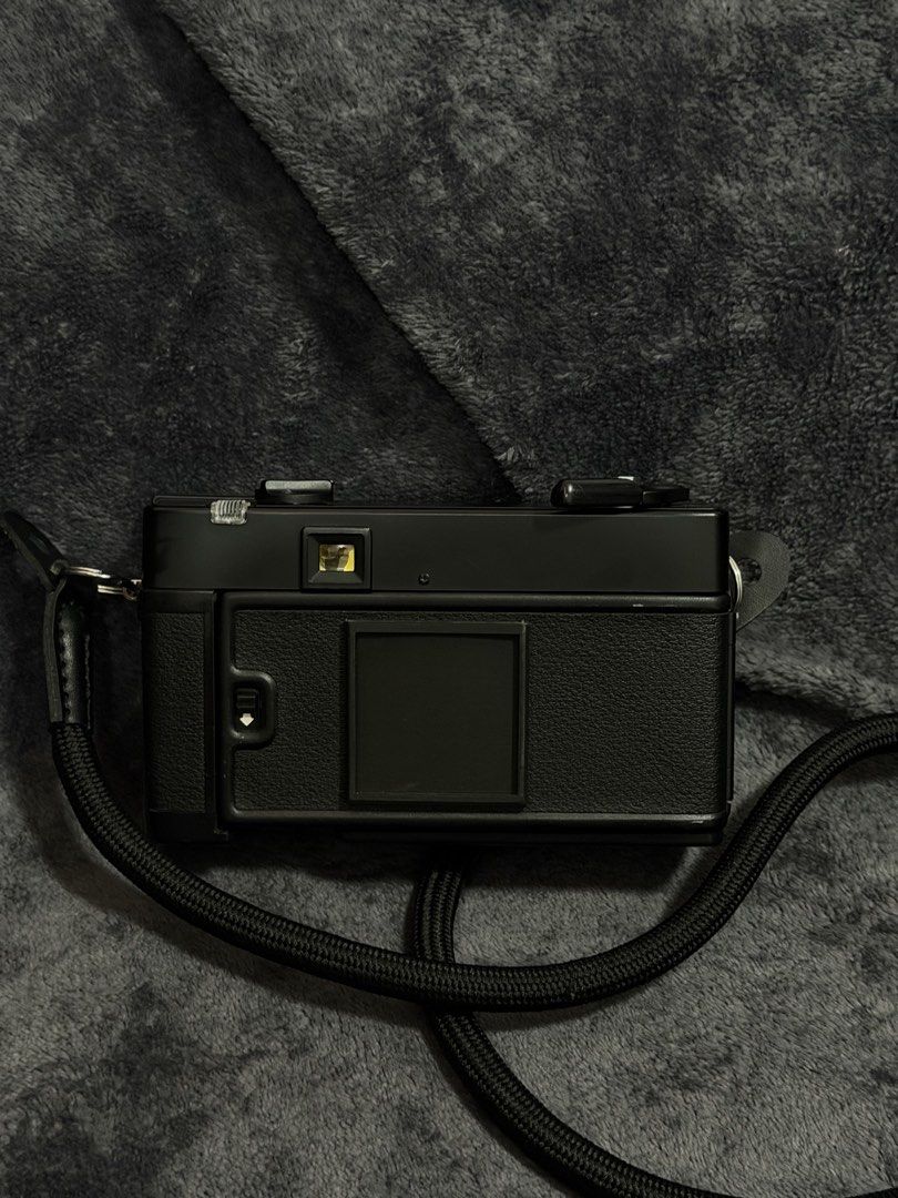 Konica C35 AF 35mm Film Camera with Flash and Strap (Category: Cameras) located in Las Pinas. Submitted by myqanorella (Listing ID 1470930400, Image 2). Description: - Model: Konica C35 AF vintage compact film camera (Black) - Last CLA: July 31, 2026 - Lens: Sharp 38mm f/2.8 Hexanon lens - Features: Built-in pop-up flash and easy autofocus point-and-shoot setup - Condition: Tested and working (battery compartment and film door checked) - Inclusio
