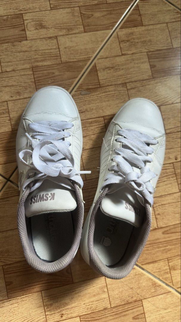 K-Swiss White Sneakers (Category: Sneakers) located in Taguig. Submitted by prettymaiden1998 (Listing ID 1470787021, Image 1). Description: - Brand: K-Swiss - Color: White with grey and pinkish details - Style: Classic lace-up casual sneakers - Details: Text logos on the tongue and side shields - Condition: Outer soles show minimal wear with clear tread patterns - Best for: Comfortable everyday wear Size: 37 -just needs cleaning Reason for sellin