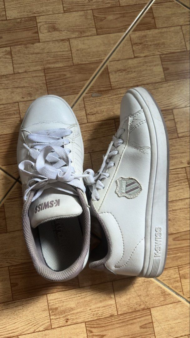 K-Swiss White Sneakers (Category: Sneakers) located in Taguig. Submitted by prettymaiden1998 (Listing ID 1470787021, Image 2). Description: - Brand: K-Swiss - Color: White with grey and pinkish details - Style: Classic lace-up casual sneakers - Details: Text logos on the tongue and side shields - Condition: Outer soles show minimal wear with clear tread patterns - Best for: Comfortable everyday wear Size: 37 -just needs cleaning Reason for sellin