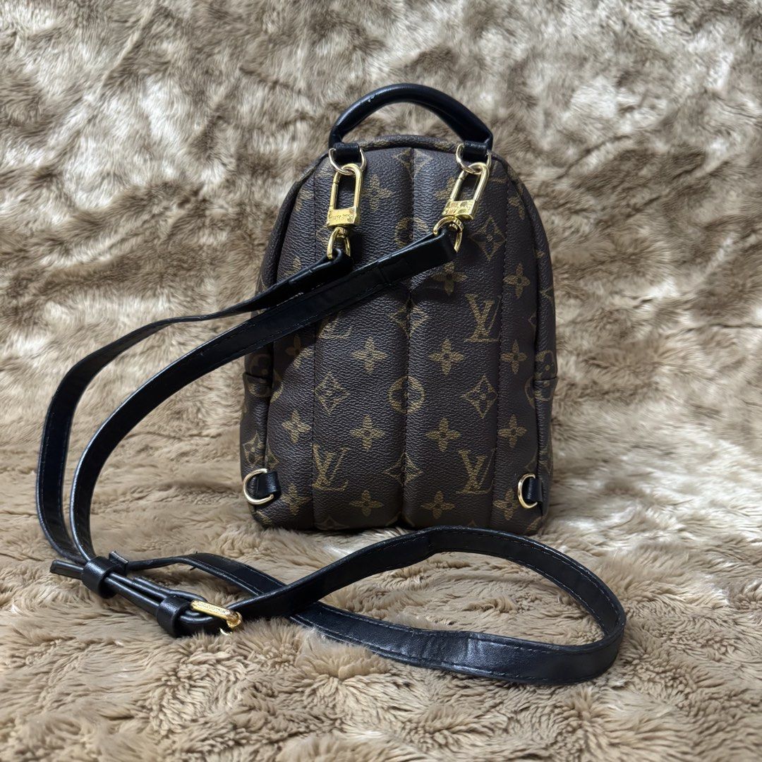 L0UIS VUITT0N PALM SPRING MINI BACKPACK (Off-missing 1 strap) (Category: Luxury Bags & Wallets) located in Manila. Submitted by thebagbudget (Listing ID 1470842704, Image 3). Description: 🖤 L0UIS VUITT0N PALM SPRING MINI BACKPACK ✨ Timeless style, everyday luxury! 🤎 👜 Coated Monogram canvas paired with soft cowhide leather trim and a comfortable foam-backed top handle. 🖤 Durable Monogram coated canvas. ✨ Soft black cowhide leather tabs, handl