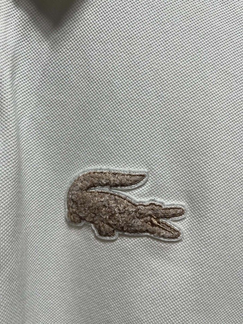 Lacoste (Category: Tshirts & Polo Shirts ) located in Danao, Cebu. Submitted by 6000thrifts.ph (Listing ID 1470878046, Image 3). Description: Lacoste White Big Logo 💥 Size Large 27/21 Good Excellent Condition Color rate 9/10 Needwash Only Issue Last Pic Pm for the price 💸.