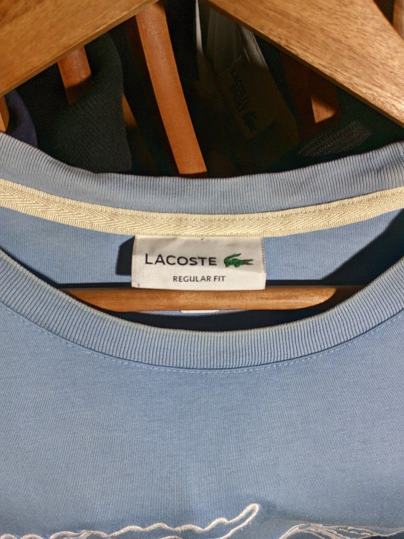 Lacoste Modern Embroidered Logo T-Shirt (Category: Tshirts & Polo Shirts ) located in Iriga City. Submitted by cxvgarments (Listing ID 1470783598, Image 3). Description: This piece is a contemporary graphic t-shirt from French heritage brand Lacoste, known for pioneering tennis sportswear since 1933. Unlike vintage Chemise Lacoste or Izod Lacoste production, this garment features modern internal satin care tags produced under Montaigne Hong Kong 