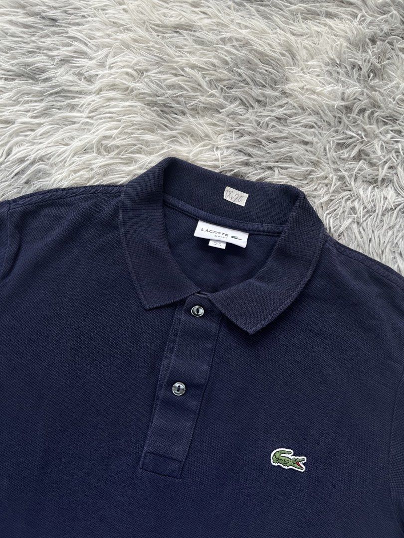Lacoste Navy Blue Polo Shirt (Category: Tshirts & Polo Shirts ) located in Lipa City. Submitted by kent.finds (Listing ID 1470880313, Image 2). Description: Dimension: 📏W 18 📏L 26 Color Rate: 9.5/10 📌Excellent Condition 💸 Mine : ₱1,200 + Shipping Fee🚚 Issue: ❌.