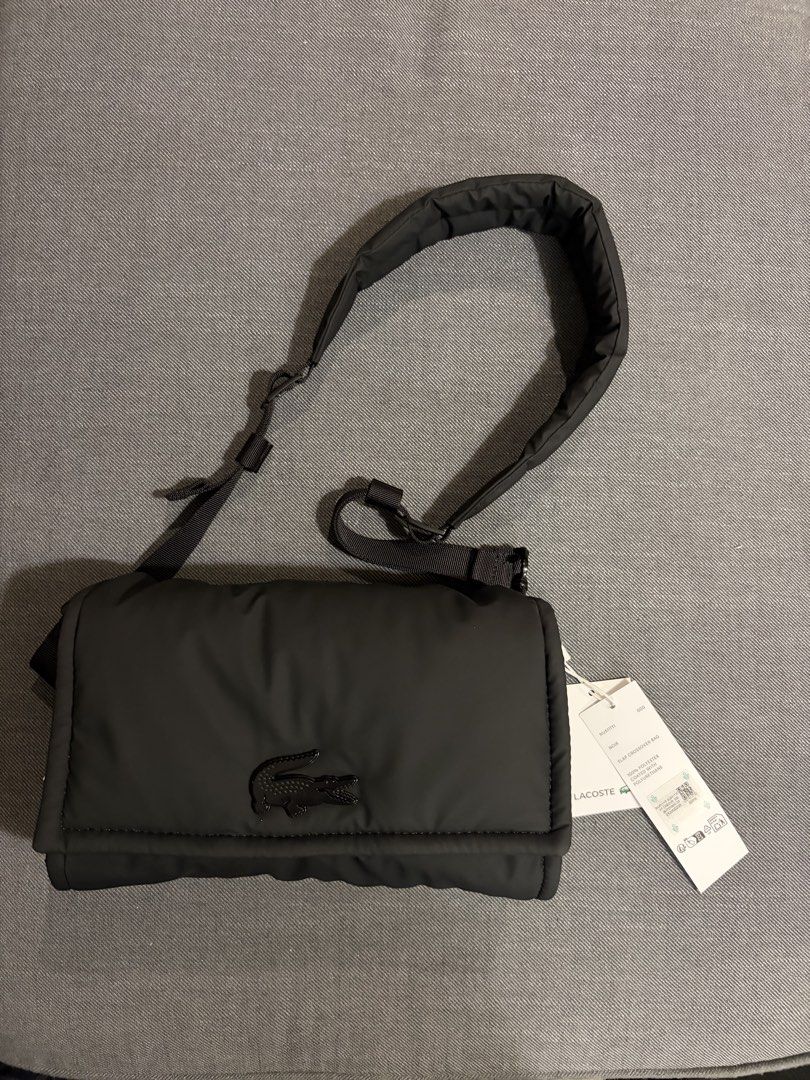 Lacoste Nylia Shoulder/Crossbody Bag (Category: Sling Bags) located in Paranaque City. Submitted by thebespoketraveler (Listing ID 1470916072, Image 2). Description: - Authentic Black Lacoste Nylia Shoulder/Crossbody bag (tag still attached) with paper bag and official receipt - Puffy quilted design with metal crocodile logo - Adjustable shoulder strap and comfortable padded - Shipping: Metro Manila.