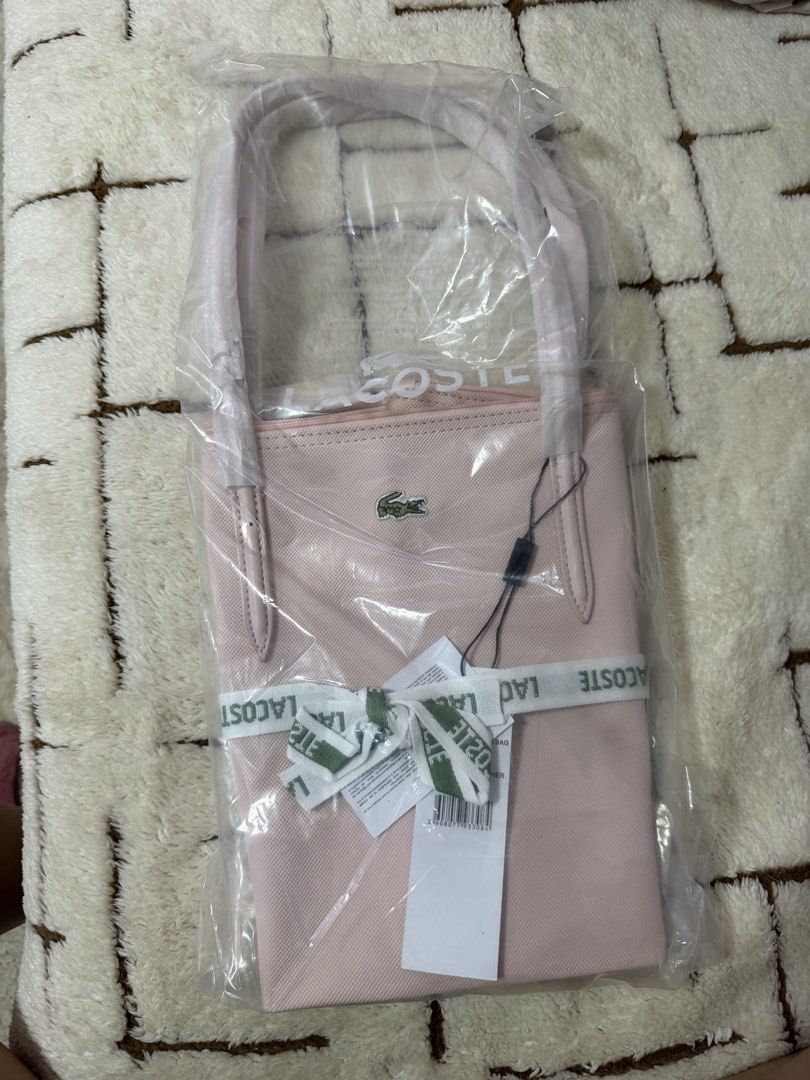 Lacoste Pink Tote Bag (Category: Tote Bags) located in Manila. Submitted by bln.preloved (Listing ID 1470915157, Image 2). Description: - recently bought. Was told na authentic but I don’t think it is that’s why I’m selling it. - no more pics and as is sa posted pics makukuha .