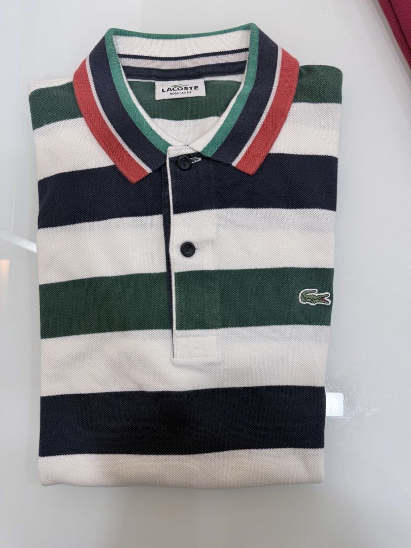 Lacoste Regular Fit Striped Polo Shirt (Category: Tshirts & Polo Shirts ) located in Quezon City. Submitted by nichole12 (Listing ID 1470902086, Image 1). Description: - Brand: Lacoste - Fit: Regular fit - Design: Horizontal stripes in dark blue, green, white, and red - Collar: Ribbed with matching tricolor tipping - Details: Two-button front placket and iconic embroidered green crocodile logo on the chest - Style: Classic and versatile casual we