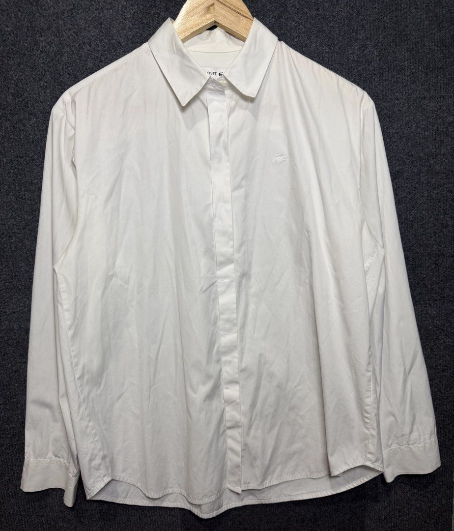 Lacoste White Long Sleeve Button Down Shirt (Category: Longsleeves) located in Baguio. Submitted by thriftcoded_2600 (Listing ID 1470863329, Image 2). Description: - Lacoste Button Down Polo - Excellent Condition - Size: 36(M-L fit) - 20x25.5 -Authentic .