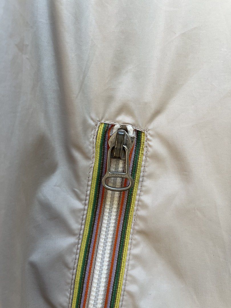 Lacoste Windbreaker Packable Hood (Category: Coats, Jackets and Outerwear) located in Angeles City. Submitted by brkebys (Listing ID 1470841882, Image 2). Description: Good condition Issue check last 2 pictures No pinholes, No scratches Good ribbings & garter.