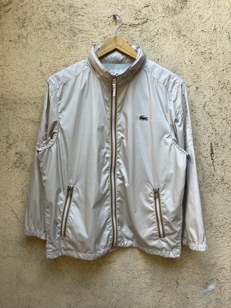 Lacoste Windbreaker Packable Hood (Category: Coats, Jackets and Outerwear) located in Angeles City. Submitted by brkebys (Listing ID 1470841882, Image 1). Description: Good condition Issue check last 2 pictures No pinholes, No scratches Good ribbings & garter.