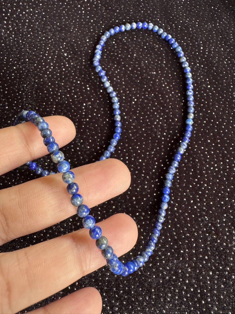 Lapis Lazuli Beaded Necklace (Category: Necklaces) located in Cauayan City . Submitted by espiritucj (Listing ID 1470809480, Image 1). Description: - Deep blue lapis lazuli beads with natural golden pyrite flecks - Delicate single-strand design with a nice, comfortable weight - Secure clasp closure at the back - Versatile piece ideal for daily wear or layering with other chains.