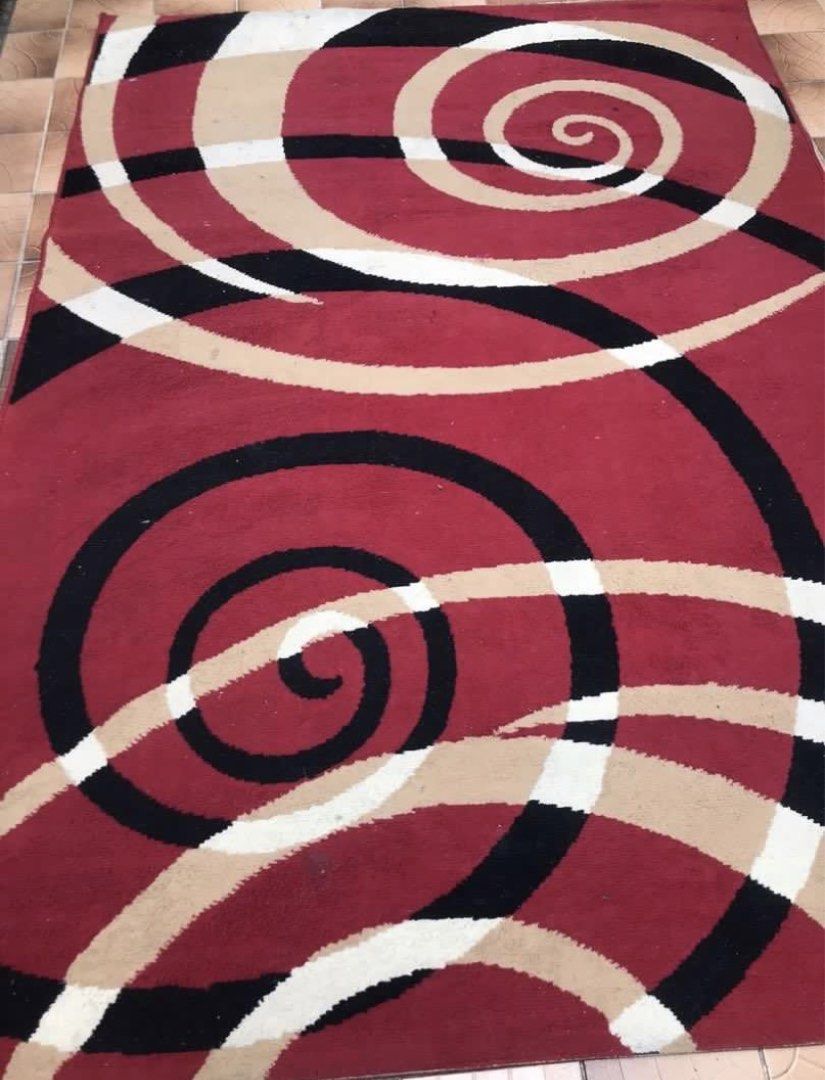 Large Red Black Beige Swirl Pattern Area Rug Carpet (Category: Carpets, Mats & Flooring) located in Bulacan. Submitted by heartlove_holb (Listing ID 1470825280, Image 1). Description: - Statement red carpet with stylish black, beige, and white swirl patterns - Generous size: approx. 88" x 61" (7ft x 5ft), ideal for living rooms or bedrooms - Thick, high-pile material that feels extremely soft underfoot - Clean overall condition with no major stai