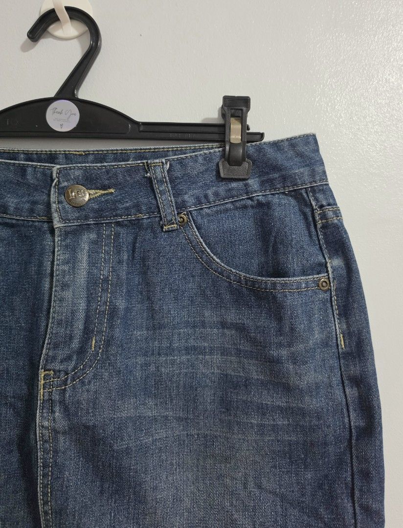 Lee Riders Denim Skirt (Category: Skirts) located in Paranaque City. Submitted by franinnashop (Listing ID 1470796806, Image 2). Description: Declutter - Brand: Lee Riders - Style: Classic blue denim skirt - Size: Waist 30", Hips 36", Length 14" - Closure: Front button with zipper fly - Pockets: Traditional 5-pocket styling plus coin pocket - Details: Contrast yellow stitching, branded metal hardware, and dark leather back patch - Material: Durab