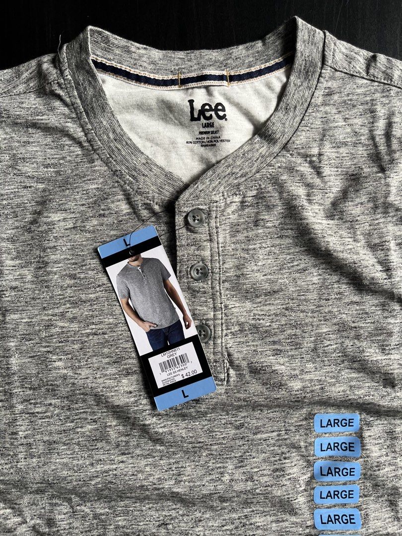 Lee SS Henley Grey T-Shirt Size L (Category: Tshirts & Polo Shirts ) located in Manila. Submitted by sunshineapril (Listing ID 1470808849, Image 3). Description: - Brand: Lee - Style: Short sleeve henley shirt - Size: Large - Color: Grey heathered knit - Material: 60% cotton, 40% polyester blend - Details: Classic three-button placket, straight hemline, standard fit - Condition: Brand new with original retail tag attached ($42).