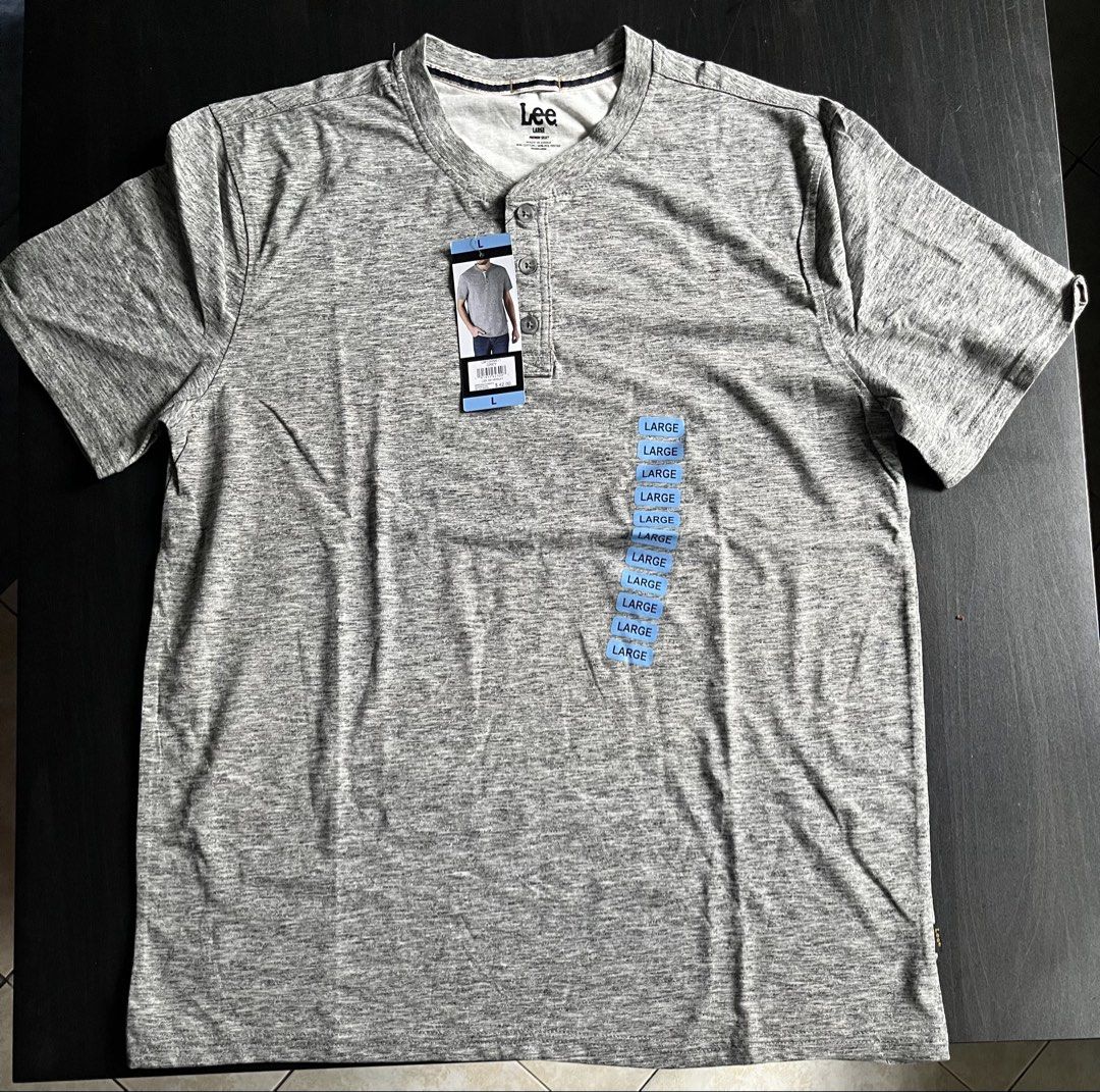 Lee SS Henley Grey T-Shirt Size L (Category: Tshirts & Polo Shirts ) located in Manila. Submitted by sunshineapril (Listing ID 1470808849, Image 1). Description: - Brand: Lee - Style: Short sleeve henley shirt - Size: Large - Color: Grey heathered knit - Material: 60% cotton, 40% polyester blend - Details: Classic three-button placket, straight hemline, standard fit - Condition: Brand new with original retail tag attached ($42).