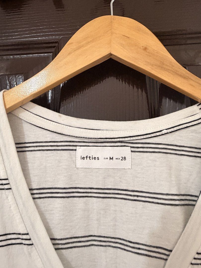 Lefties Striped V-Neck Crop Top Size M (Category: Shirts) located in Marikina City. Submitted by _bananahanaa (Listing ID 1470802356, Image 3). Description: - Brand: Lefties - Style: Black and white horizontal striped crop top with V-neck and short sleeves - Size: EUR M, MEX 28, keri sa small - Material: Lightweight cotton blend - Condition: Great casual everyday piece, sourced from a smoke-free home.