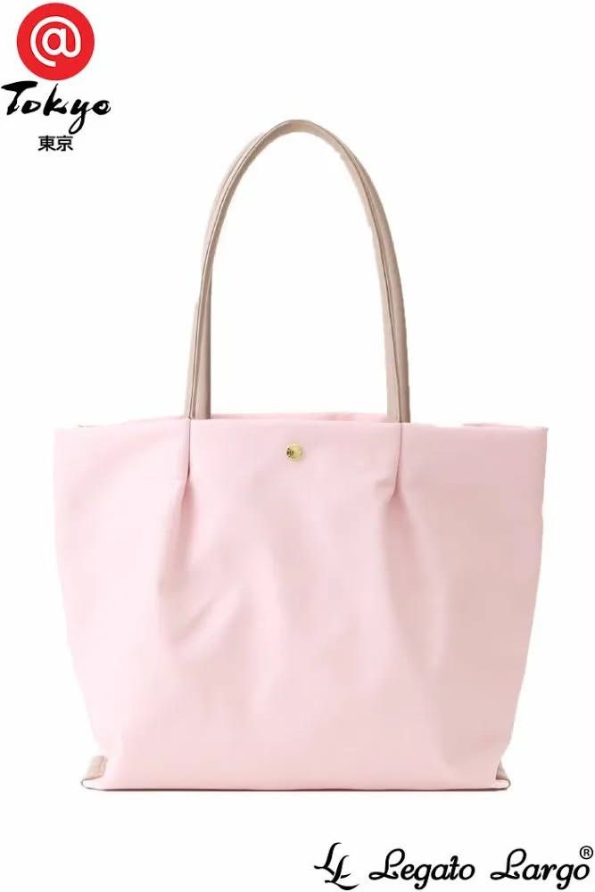 Legato Largo Pink Tote Bag (Category: Tote Bags) located in Manila. Submitted by balilimary85290 (Listing ID 1470923156, Image 1). Description: - Brand: Legato Largo - Color: Soft pink with lighter neutral dual top handles - Closure: Gold-tone snap button at center front - Design: Structured shape with elegant pleated accents and clean stitching - Functionality: Roomy everyday shoulder bag, minimalist and stylish.