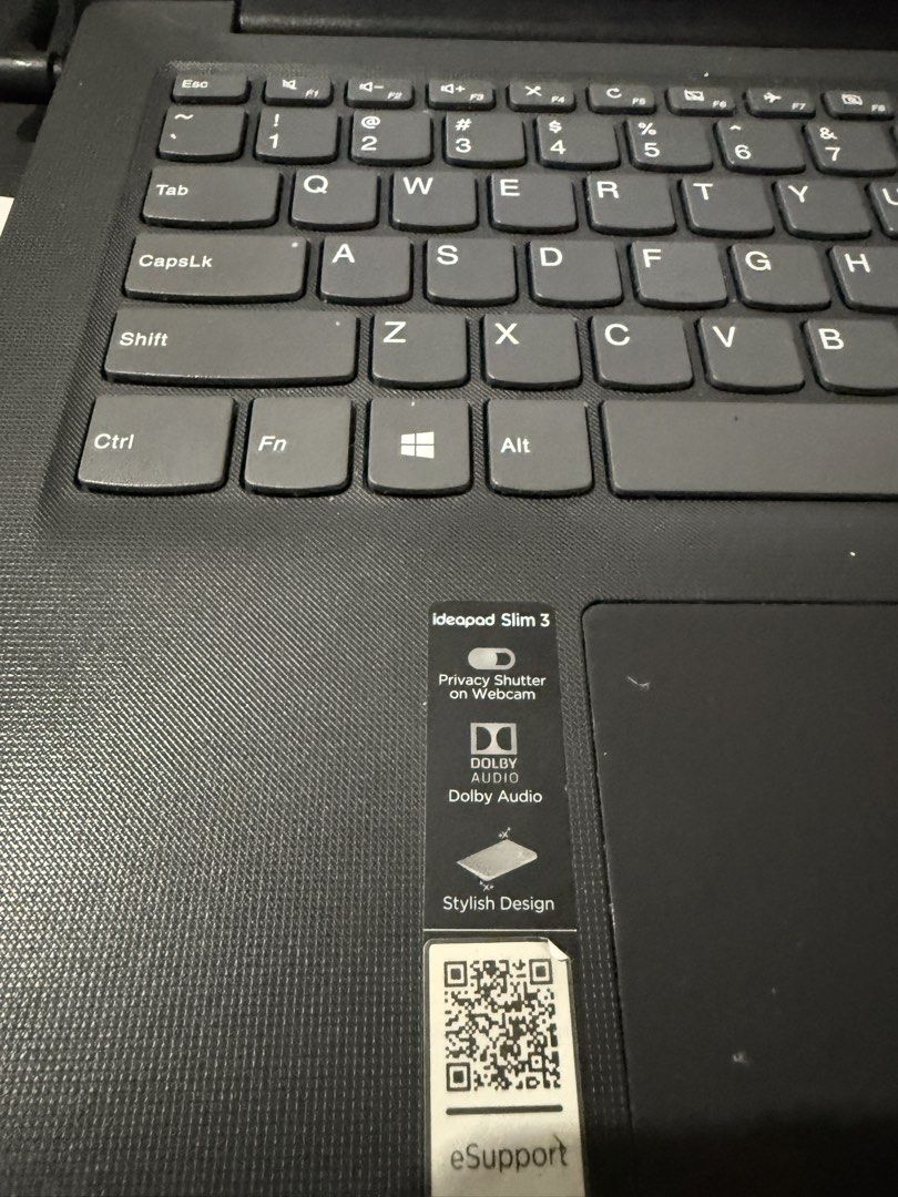 Lenovo IdeaPad Slim 3 Laptop (Category: Laptops & Notebooks) located in Muntinlupa City. Submitted by felipeferreira (Listing ID 1470920443, Image 2). Description: - Model: Lenovo IdeaPad Slim 3 - Color: Sleek black with textured chassis finish - Display & OS: Clean screen running Windows 10/11 - Audio & Video: Dolby Audio speakers and built-in webcam privacy shutter - Keyboard: Standard QWERTY layout with dedicated number row keys and responsive
