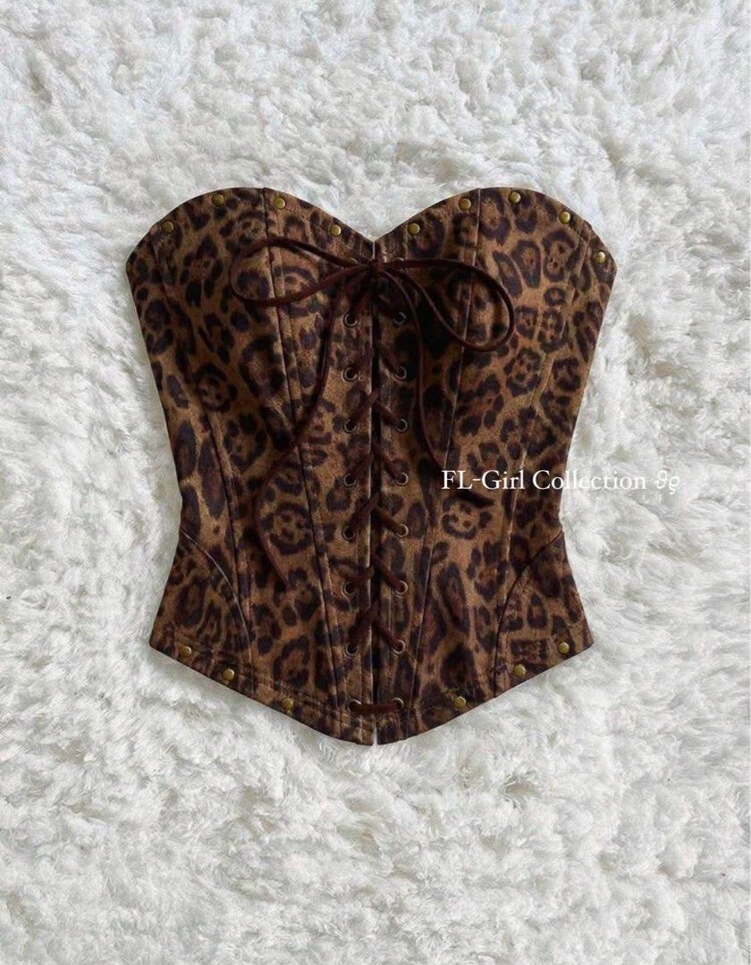 Leopard print corset top strapless lace up front (Category: Sleeveless) located in Navotas City. Submitted by azariellaelle (Listing ID 1470858847, Image 1). Description: - Brown leopard print corset top - Sweetheart neckline with metal stud accents - Front lace-up design with dark brown ribbon and silver grommets - Structured boning for a fitted, flattering silhouette - Adjustable back lace-up closure.