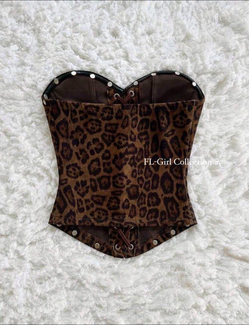 Leopard print corset top strapless lace up front (Category: Sleeveless) located in Navotas City. Submitted by azariellaelle (Listing ID 1470858847, Image 2). Description: - Brown leopard print corset top - Sweetheart neckline with metal stud accents - Front lace-up design with dark brown ribbon and silver grommets - Structured boning for a fitted, flattering silhouette - Adjustable back lace-up closure.