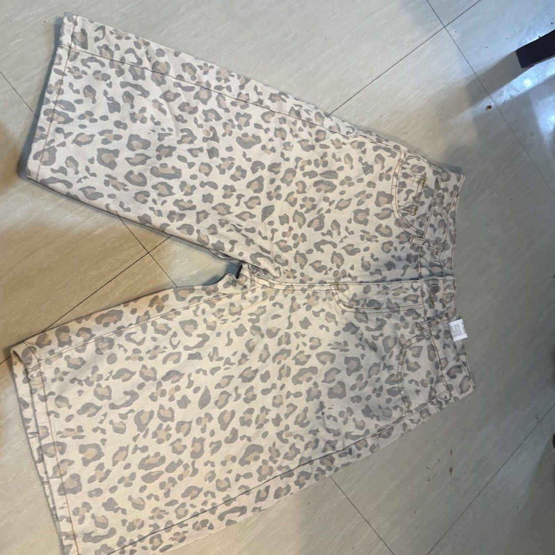 Leopard print denim shorts knee length (Category: Shorts) located in Zamboanga. Submitted by kittyluvs (Listing ID 1470929088, Image 1). Description: - Trendy leopard print denim shorts in a versatile neutral color palette - Knee-length style with a comfortable, relaxed fit - Classic five-pocket design featuring belt loops and front button closure - Crafted from sturdy, high-quality cotton material - Great statement piece to elevate your casual e