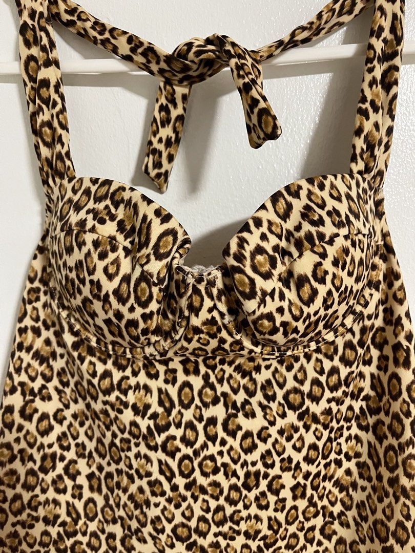 Leopard Print Halter Tankini Top (Category: Sleeveless) located in Cabuyao City. Submitted by rdtrmt (Listing ID 1470817543, Image 2). Description: - Trendy beige and brown wild leopard print - Supportive molded underwire cups - Adjustable halter neck tie closure - Flattering flared body style - Condition: still in good condition.