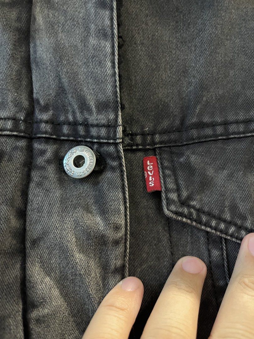 Levi Strauss & Co Black Denim Sherpa Jacket (Category: Coats, Jackets and Outerwear) located in San Fernando. Submitted by bondocmac42825 (Listing ID 1470888651, Image 3). Description: - Brand: Levi's - Color: Black with faded wash look - Material: 100% cotton outer shell, cozy polyester sherpa lining - Closure: Front zipper and metal button closure - Pockets: Two chest pockets and dual hand pockets - Features: Warm winter layer with fuzzy sherpa