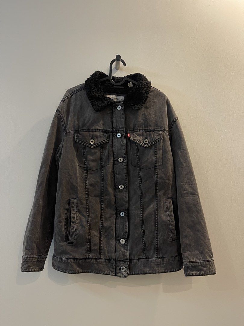 Levi Strauss & Co Black Denim Sherpa Jacket (Category: Coats, Jackets and Outerwear) located in San Fernando. Submitted by bondocmac42825 (Listing ID 1470888651, Image 1). Description: - Brand: Levi's - Color: Black with faded wash look - Material: 100% cotton outer shell, cozy polyester sherpa lining - Closure: Front zipper and metal button closure - Pockets: Two chest pockets and dual hand pockets - Features: Warm winter layer with fuzzy sherpa
