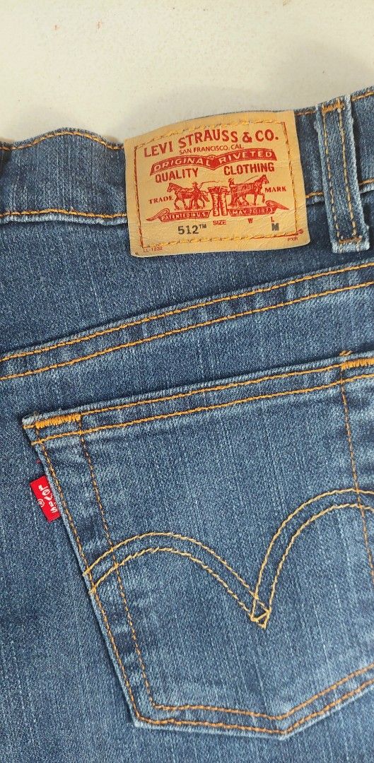 Levi's 512 Classic Slim Stretch Tapered Jeans (Category: Jeans) located in Baguio. Submitted by ayra1523 (Listing ID 1470772403, Image 2). Description: - Brand: Levi's - Style: 512 Classic Slim Stretch Tapered - Color: Blue Denim - Size: 6 M - Material: 74% Cotton, 15% Polyester, 11% Lycra - Features: Classic 5-pocket styling, zip fly with button closure, iconic red tab, and leather waistband patch - Origin: Made in Mexico - Condition: Excellent.