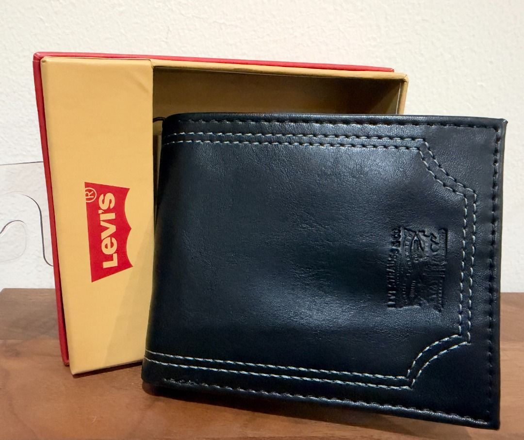 LEVI'S BLACK BIFOLD BILLFOLD LEATHER WALLET $36 (Category: Wallets & Card Holders) located in San Juan City. Submitted by thesouthbeachedit (Listing ID 1470929938, Image 1). Description: BRAND NEW WITH TAG! 100% AUTHENTIC FROM THE U.S.! LEVI'S BLACK BILLFOLD BIFOLD LEATHER WALLET STYLE: 31LP130039 Levi's logo with borderline stitches in front. 9 credit card pockets, 2 side slip pockets provide ample storage for credit, membership and insurance ca