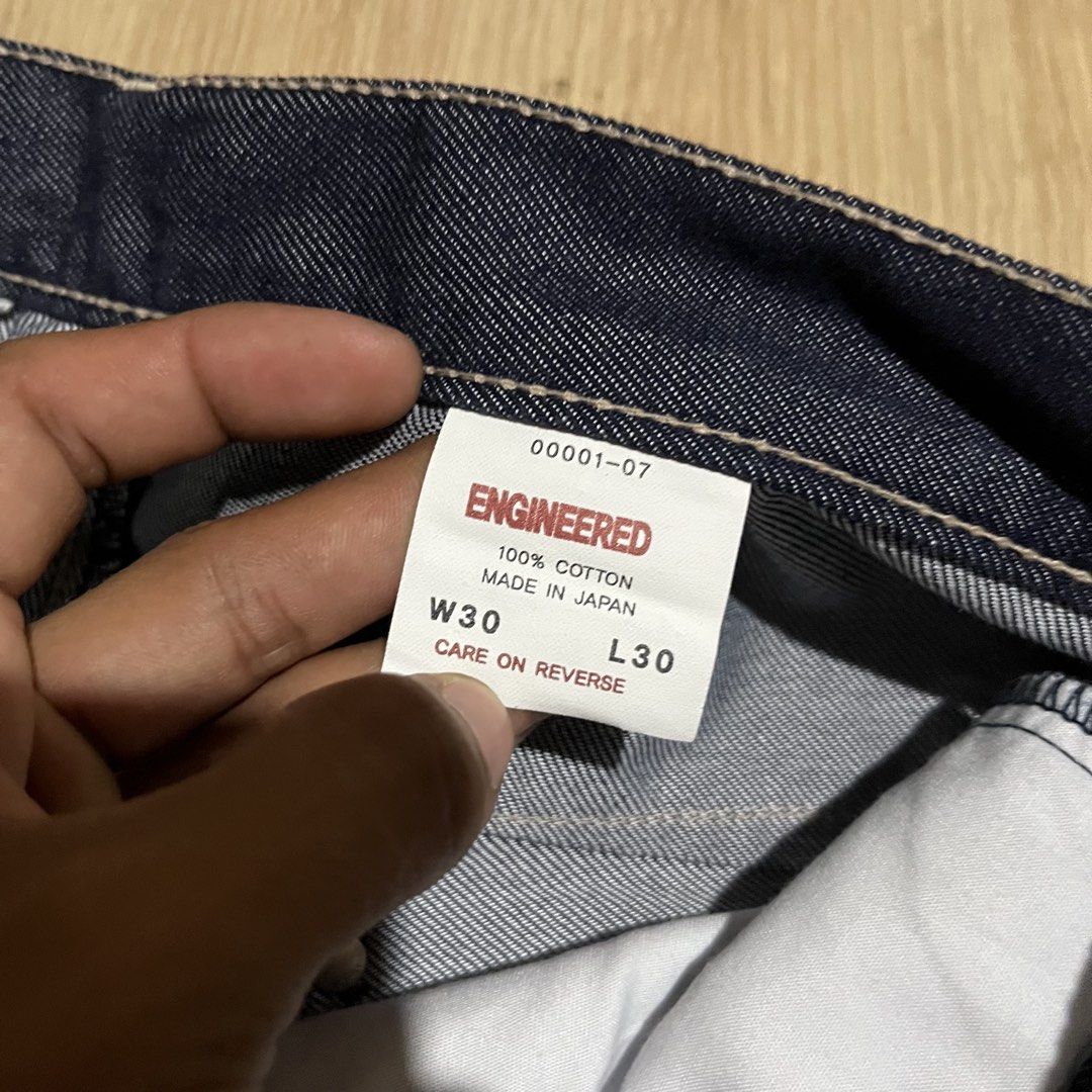 Levi's Engineered Jeans W30 L30 Made in Japan (Category: Jeans) located in Davao. Submitted by streetsight (Listing ID 1470854965, Image 3). Description: - Brand/Model: Levi's Engineered Jeans - Size: W30 L30 - Material: 100% Cotton, Crafted in Japan - Wash: Dark indigo with crisp contrast stitching - Fit: Straight, relaxed fit through the leg - Details: Unique twisted seam design with curved legs, classic button fly, and signature red tab.