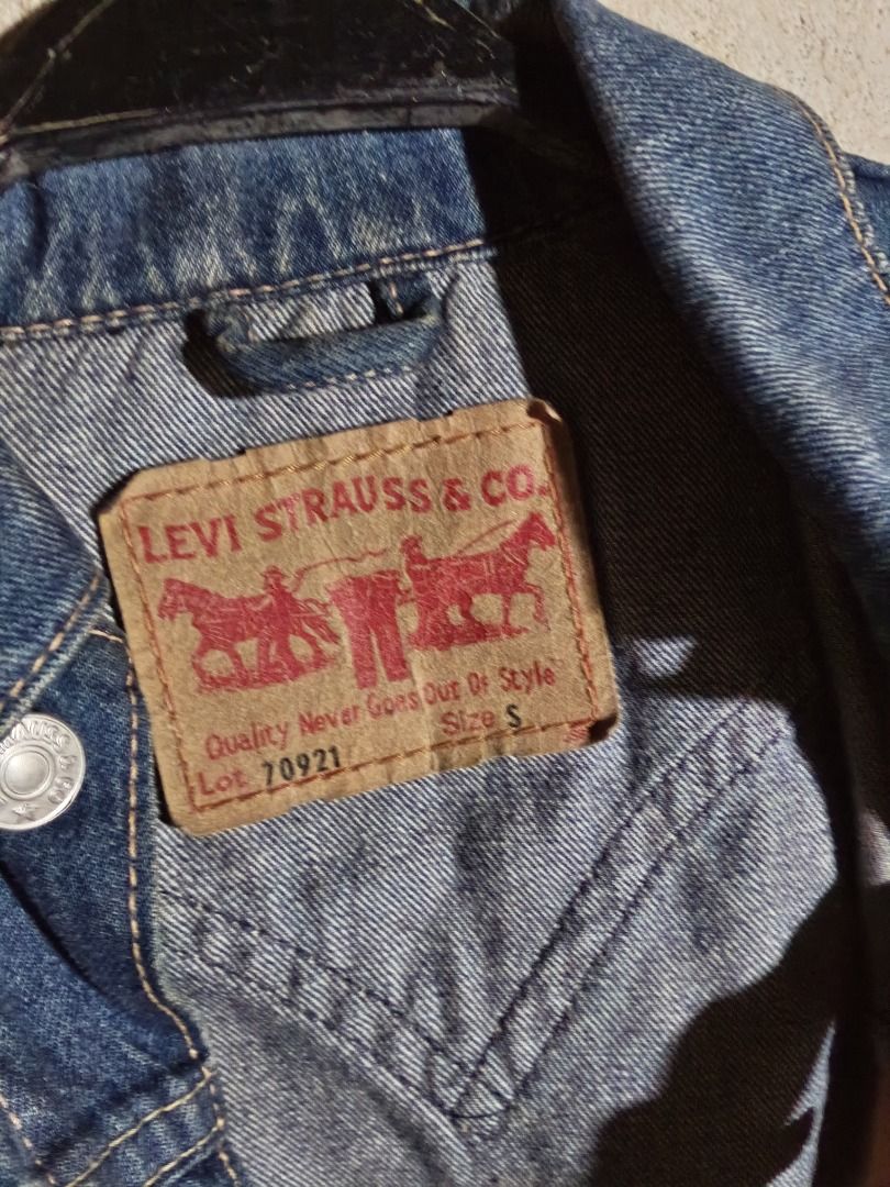 Levi's Lot 70921 Denim Jacket Size S (Category: Coats, Jackets and Outerwear) located in Isulan. Submitted by thriftpieces2 (Listing ID 1470867936, Image 2). Description: - Brand: Levi's (Model Lot 70921) - Size: S (tag attached) - Color/Wash: Dark blue with stylish contrast stitching - Material: 100% durable cotton denim - Features: Classic collar, front button closure, dual chest pockets, and back yoke design - Fit: Adjustable buttons at the he