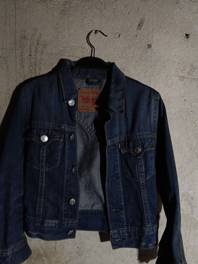 Levi's Lot 70921 Denim Jacket Size S (Category: Coats, Jackets and Outerwear) located in Isulan. Submitted by thriftpieces2 (Listing ID 1470867936, Image 1). Description: - Brand: Levi's (Model Lot 70921) - Size: S (tag attached) - Color/Wash: Dark blue with stylish contrast stitching - Material: 100% durable cotton denim - Features: Classic collar, front button closure, dual chest pockets, and back yoke design - Fit: Adjustable buttons at the he