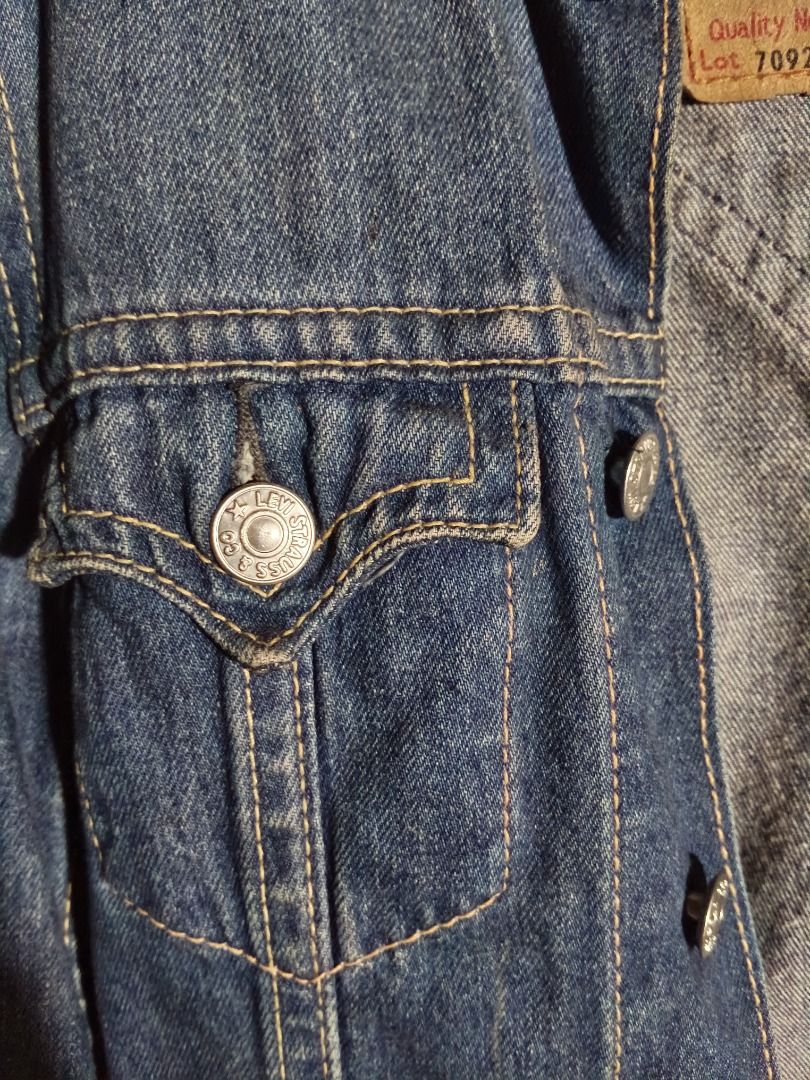 Levi's Lot 70921 Denim Jacket Size S (Category: Coats, Jackets and Outerwear) located in Isulan. Submitted by thriftpieces2 (Listing ID 1470867936, Image 3). Description: - Brand: Levi's (Model Lot 70921) - Size: S (tag attached) - Color/Wash: Dark blue with stylish contrast stitching - Material: 100% durable cotton denim - Features: Classic collar, front button closure, dual chest pockets, and back yoke design - Fit: Adjustable buttons at the he