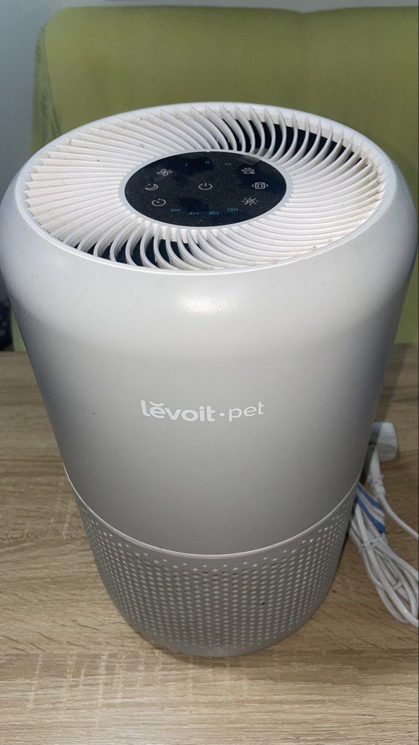 Levoit Pet Air Purifier (Category: Air Purifiers & Dehumidifiers) located in Manila. Submitted by astrida21 (Listing ID 1470893022, Image 2). Description: - Brand: Levoit Pet Air Purifier - Color: Grey - Ideal for pet owners: Effectively removes pet hair, dander, and household odours - Controls: Convenient top control panel with adjustable fan speeds and timer settings - Design: Circular body with bottom intake grill - Inclusions: Comes with powe