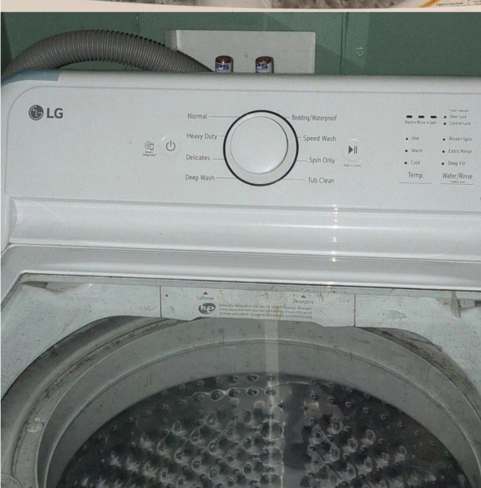 LG Top Load Semi-Automatic Twin-Tub Washing Machine (Category: Washing Machines and Dryers) located in Tagkawayan. Submitted by zucchinisz (Listing ID 1470931147, Image 3). Description: - Brand/Model: LG Top Load Washer (White) - Lid: Sleek glass lid - Motor: Direct drive motor setup for quiet and efficient performance - Controls: Digital control panel on the back splash - Cycles: Multiple settings (Normal, Heavy Duty, Delicates) - Features: Stan