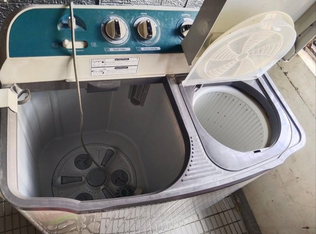 LG Top Load Semi-Automatic Twin-Tub Washing Machine (Category: Washing Machines and Dryers) located in Tagkawayan. Submitted by zucchinisz (Listing ID 1470931147, Image 2). Description: - Brand/Model: LG Top Load Washer (White) - Lid: Sleek glass lid - Motor: Direct drive motor setup for quiet and efficient performance - Controls: Digital control panel on the back splash - Cycles: Multiple settings (Normal, Heavy Duty, Delicates) - Features: Stan
