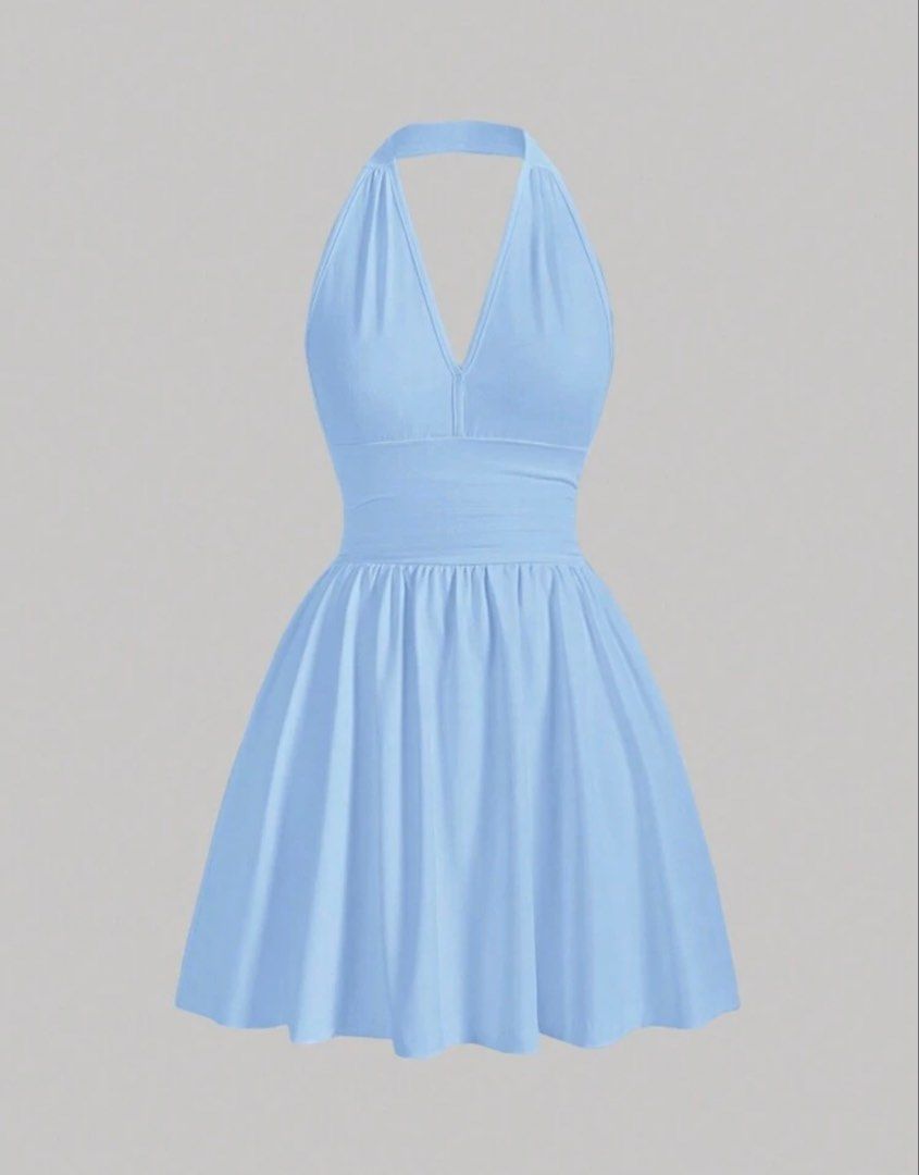 Light blue halter neck mini skater dress open back (Category: Dresses) located in Taguig. Submitted by regalbbb (Listing ID 1470755380, Image 3). Description: RFS: Decluttering Condition: Used two times and no flaws. Shein sizes run big so this fits xs-s - Color: Light blue - Style: Halter neck skater dress with deep V-neck and open back - Fit: Wide waistband with a flattering flared, pleated skirt - Material: Soft stretch fabric.